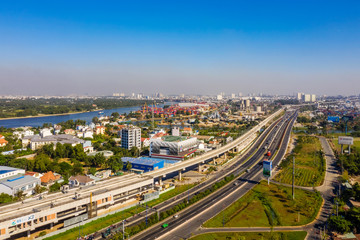 Top view aerial of Ha Noi highway view from district 2 to district 9, Ho Chi Minh City with development buildings, transportation, infrastructure, Vietnam. 
