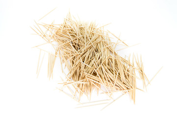 A very chaotic pile of toothpicks, isolated on white background