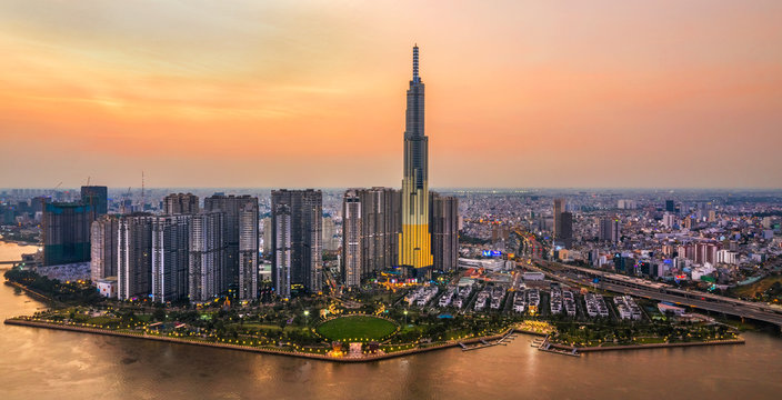 Top view aerial of center Ho Chi Minh City and Saigon bridge with development buildings, transportation, energy power infrastructure. Financial and business centers in  Vietnam. View from District 2