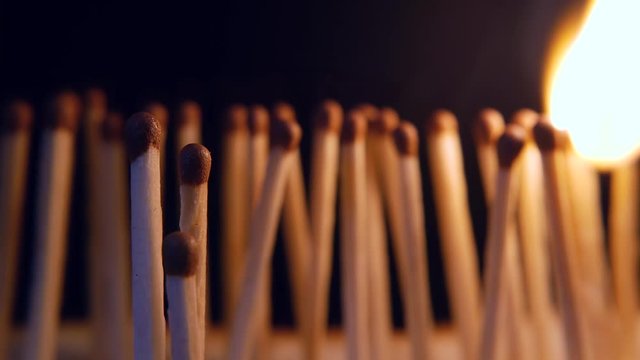 Burning matches domino effect. Social self isolation, distance concept. Stay at home Covid-19. Quarantine epidemic chain reaction. nCoV virus pandemic outbreak symbolic metaphor. Coronavirus disease