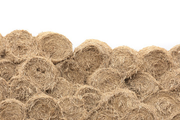 A big of hay stack Wall - Straw bales. isolated on white background.