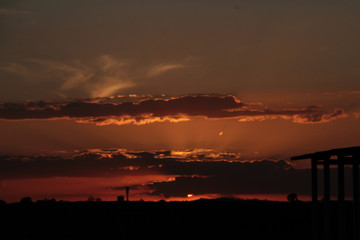 sunset over the airport with silhouette - zoom