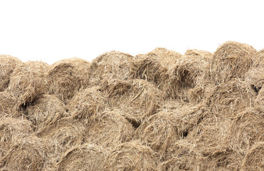 A big of hay stack Wall - Straw bales. isolated on white background.