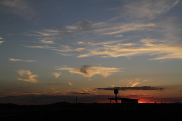 sunset over the airport with silhouette