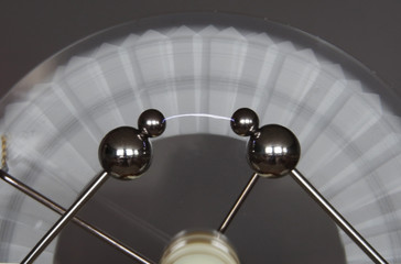 Spinning Wimshurst machine induces a small lightning bolt.