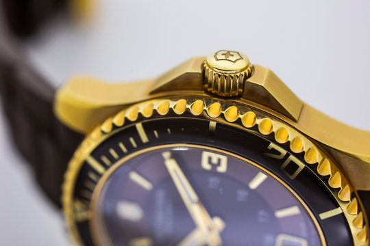 Ibach, Switzerland 31.03.2020 - The close up of Victorinox man watch stainless steel case gold PVD coating swiss quartz mechanical watch swiss made manufacture isolated