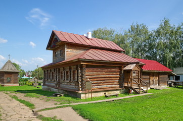 Fototapeta na wymiar Suzdal, Russia - July 26, 2019: House with a mezzanine in museum of wooden architecture and peasant life. Golden ring of Russia 