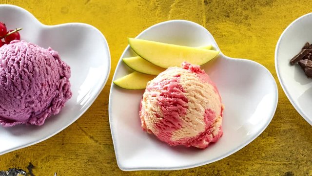 Delicious summer ice cream slide with various scoops in a row
