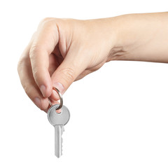Male hand offering a house key, isolated on white background
