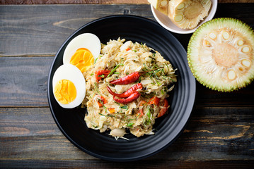 Northern Thai food (Tam Khanun), spicy pounded young jackfruit salad with boiled egg, Top view