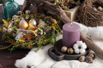 Easter still life with candles and easter decoration. Easter holiday concept. Close-up.