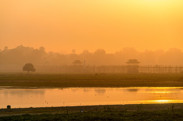 Royalty high quality free stock image of silhouettes of people and Bridge U-Bein teak bridge is the longest. in Amarapura ,Mandalay ,Myanmar