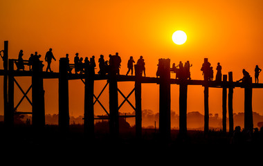 Royalty high quality free stock image of silhouettes of people and Bridge U-Bein teak bridge is the longest. in Amarapura ,Mandalay ,Myanmar