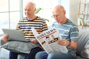 Elderly men resting together at home