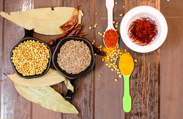 Herbs and Spices with colorful wooden background