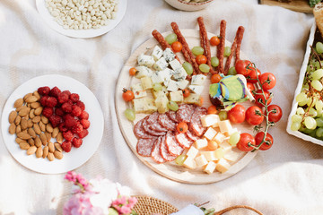 Chopping board with meat and cheese. Italian style banquet. Top view. outdoor