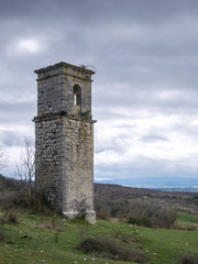 Old church tower of the abandonded haunted village of Ochate, Trevino Country, Burgos, Spain