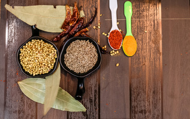 Herbs and Spices with colorful wooden background
