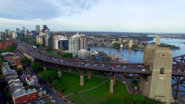Traffic on the Sydney Harbour Bridge at sunrise, slow motion aerial view
