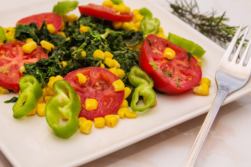 spinach, tomato and corn salad, healthy diet concept