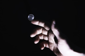 Volatility of the national currency. Russian coins with the inscription "ruble". Low ruble exchange rate. Fall of course. Financial crisis. Ruble in the hand.