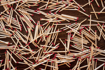 Spattered matches on a wooden table