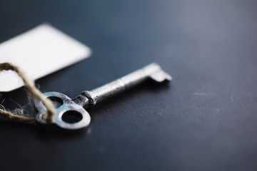 Set of vintage keys for a lock. Retro keys on a dark stone background. The concept of choosing the path to achieve the goal.