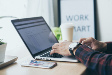 work from home.using computer.hand typing message on keyboard laptop online chatting search form internet while working.concept for technology device contact communication business people