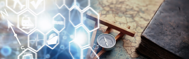 Travel and adventure search concept. Vintage aged map with a shabby book and compass. Shabby book and compass on the table.