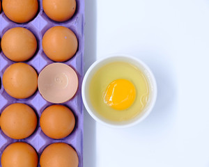 Close-up view of raw chicken eggs on background