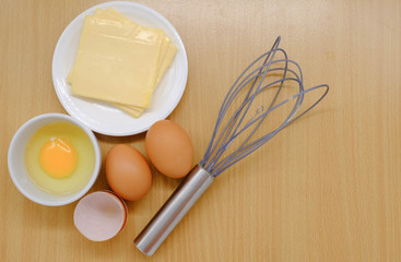 Close-up view of raw chicken eggs on background