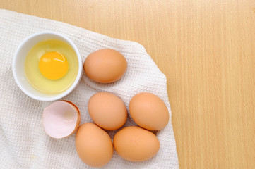 Close-up view of raw chicken eggs on background