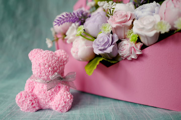 Bouquet of soap flowers in pink envelope and pink rose bear
