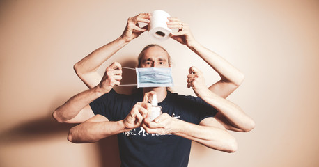 Shiva like autoportrait during the covid 19 lockdown with toilet paper rolli fave mask and hydroalcoholic gel