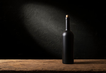 Wine bottles with glass, wooden background border