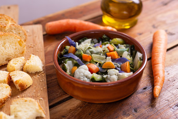 Mixed fresh vegetables with bread. Minestrone, detox food. 