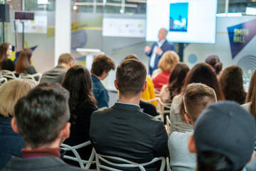 Audience listens lecturer at workshop