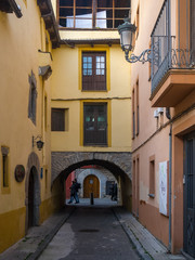Colorful buildings in a small narrow street in the old town of Jaca, Huesca, Aragon, Spain