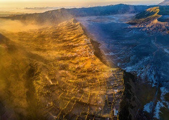 Aerial view of Cemoro Lawang village next to the Mount Bromo, is an active volcano and part of the Tengger massif, in East Java, Indonesia. Famous travel destination backpacker in south east asia