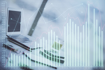 Naklejka premium Stock market graph and table with computer background. Multi exposure. Concept of financial analysis.
