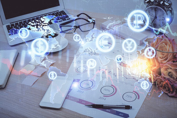 Financial graph colorful drawing and table with computer on background. Double exposure. Concept of international markets.