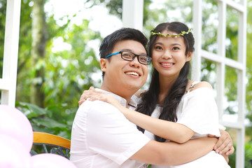 Outdoor portrait of asian lovers