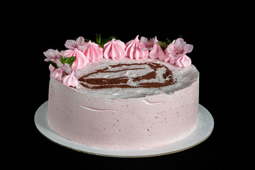 Pink marshmallow cake on a black background with a painted machine