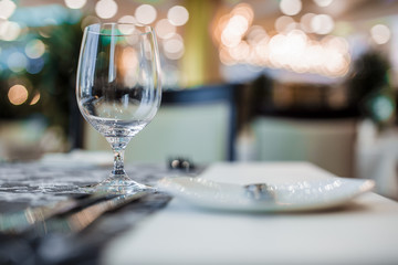 Serving the dining table in the restaurant. Empty glass.