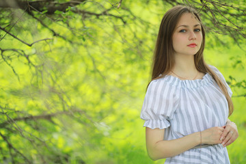 A girl in a spring green park