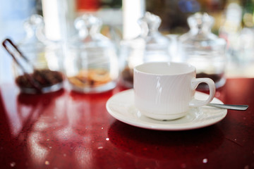 White Cup on the background of a set of ingredients for tea