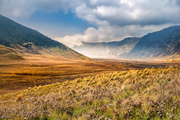 Aerial view of Sea of sand area around Mount Bromo, is an active volcano and part of the Tengger massif, in East Java, Indonesia. Famous travel destination backpacker in south east asia