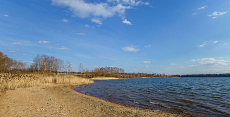 Lakeshore sand beach spring time