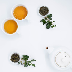 Obraz na płótnie Canvas teapot and tea on white background, over light