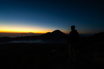 Aerial view of travel people with backpack on volcano Batur in the tropical island Bali. Royalty high quality free stock image of Danau Batur, Indonesia.